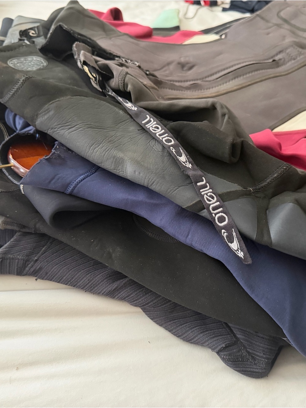 Lot of various wetsuits Stack